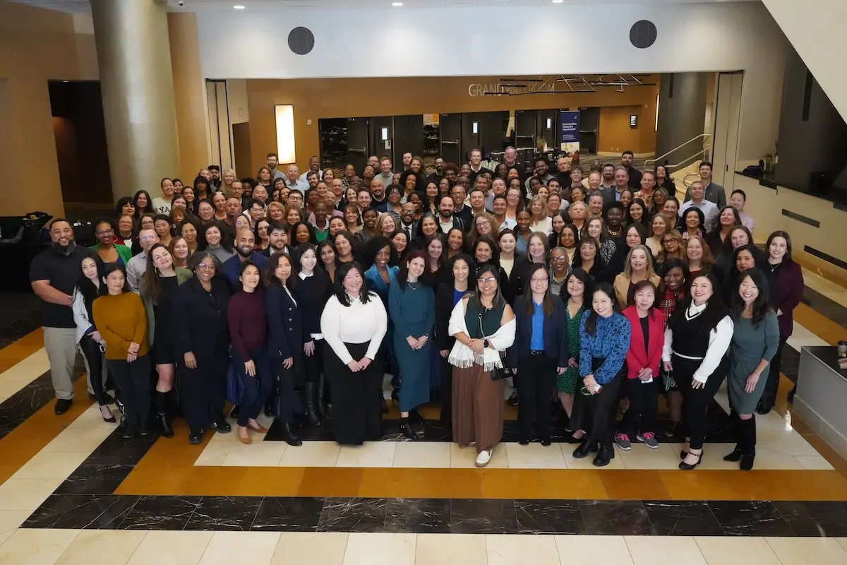 The LIIF team gathered together in a lobby.